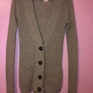 Brown button down sweater.